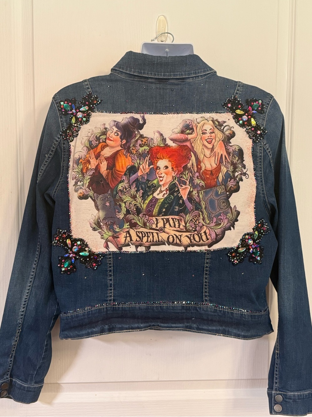 torrid dark blue denim jacket with colorful embellished spellback artwork